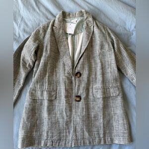 Plaid blazer with polka dot accent